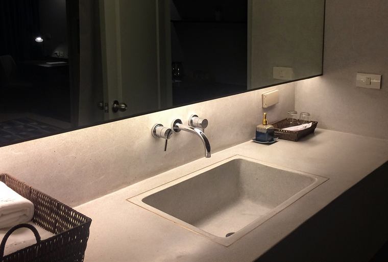 A salvaged sink on the fixture shelf