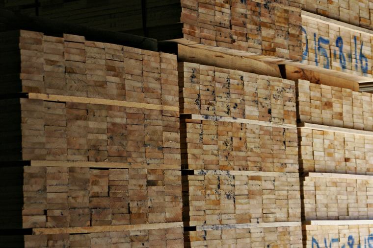 Stacked lumber waiting in the yard